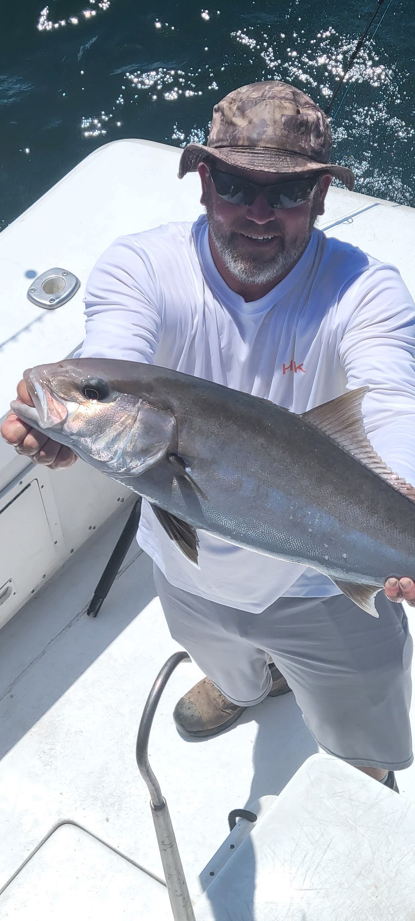 Angler with a nice amberjack on the boat