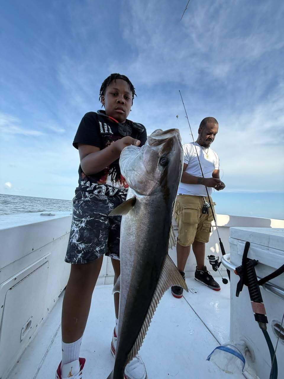 Young angler with a big cobia catch